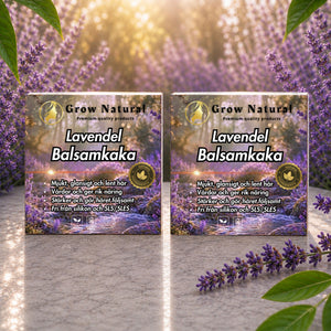 Tvåpack Grow Natural lavendel balsamkaka med lavendelblommor i en solbelyst miljö.